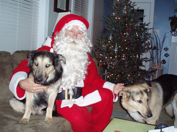 Cinco (on left), with Santa and Randi